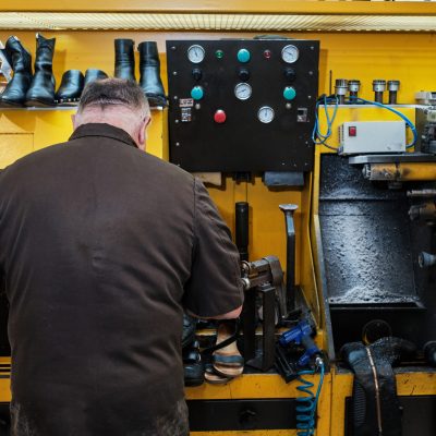 A shoemaker working in a workshop
